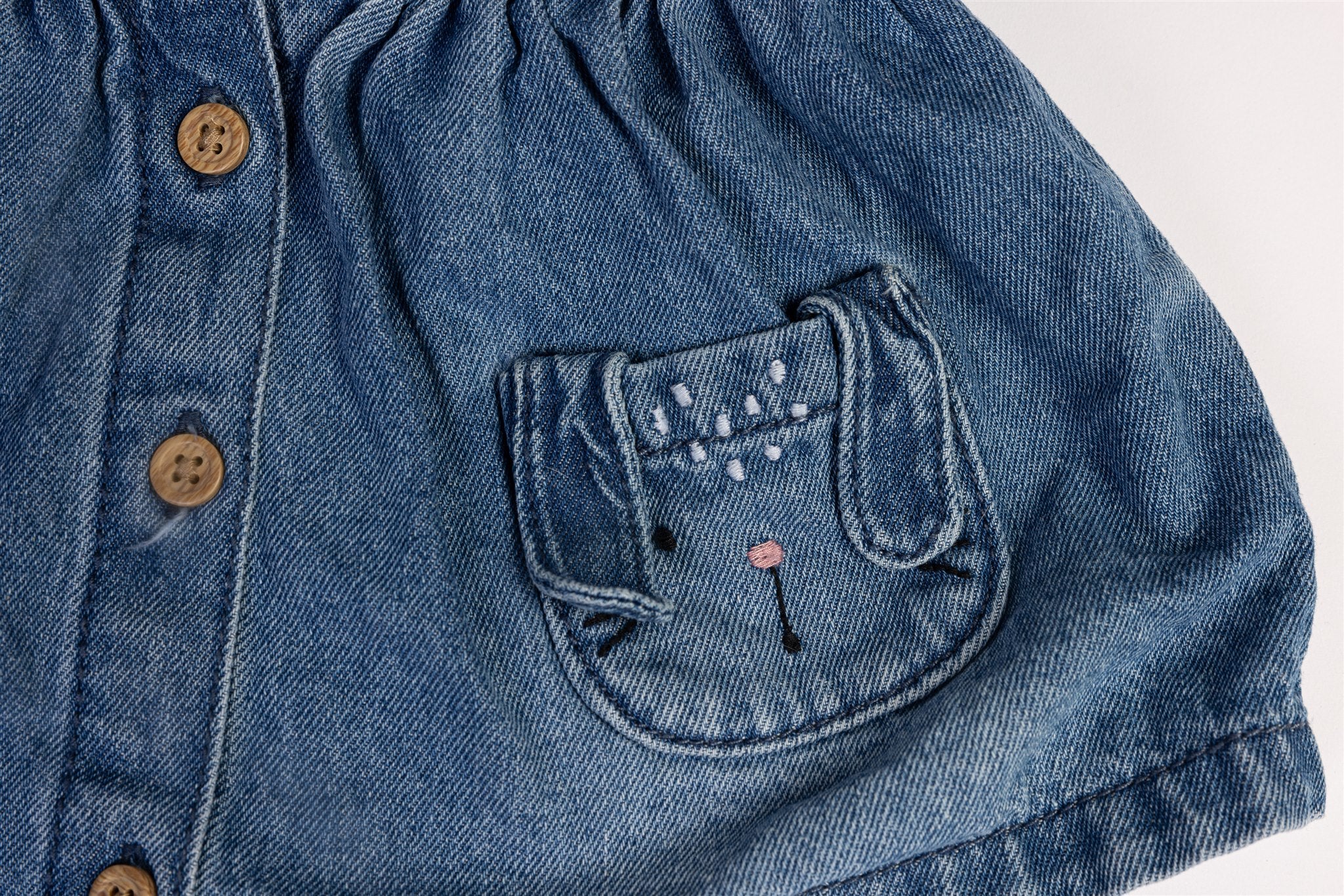 Denim pinafore dress with bunny pockets