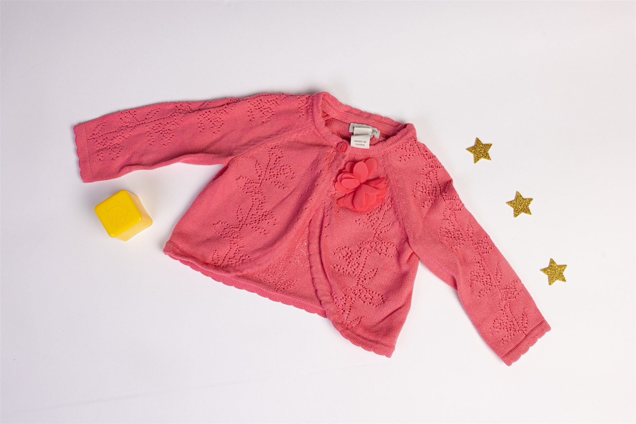 Pink knitted cardigan with floral detail