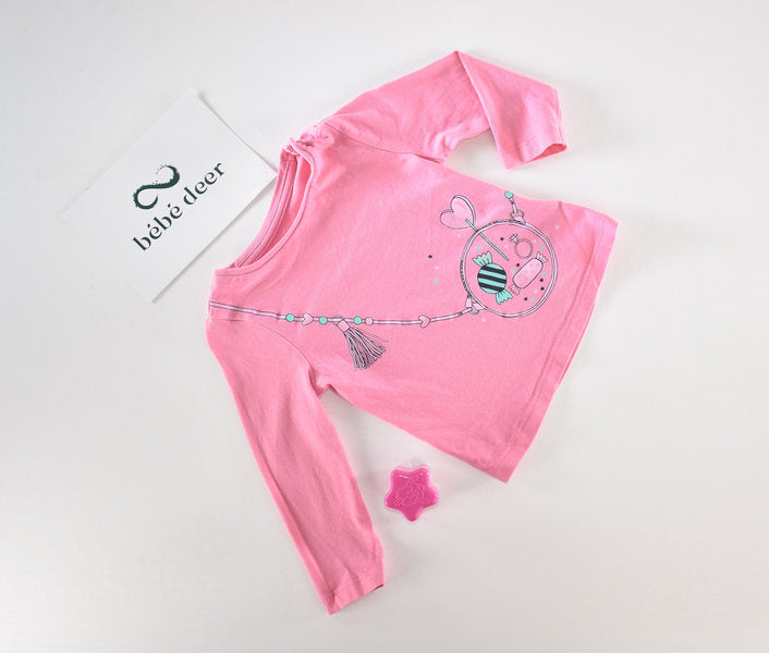 Pink top with sweets and heart design