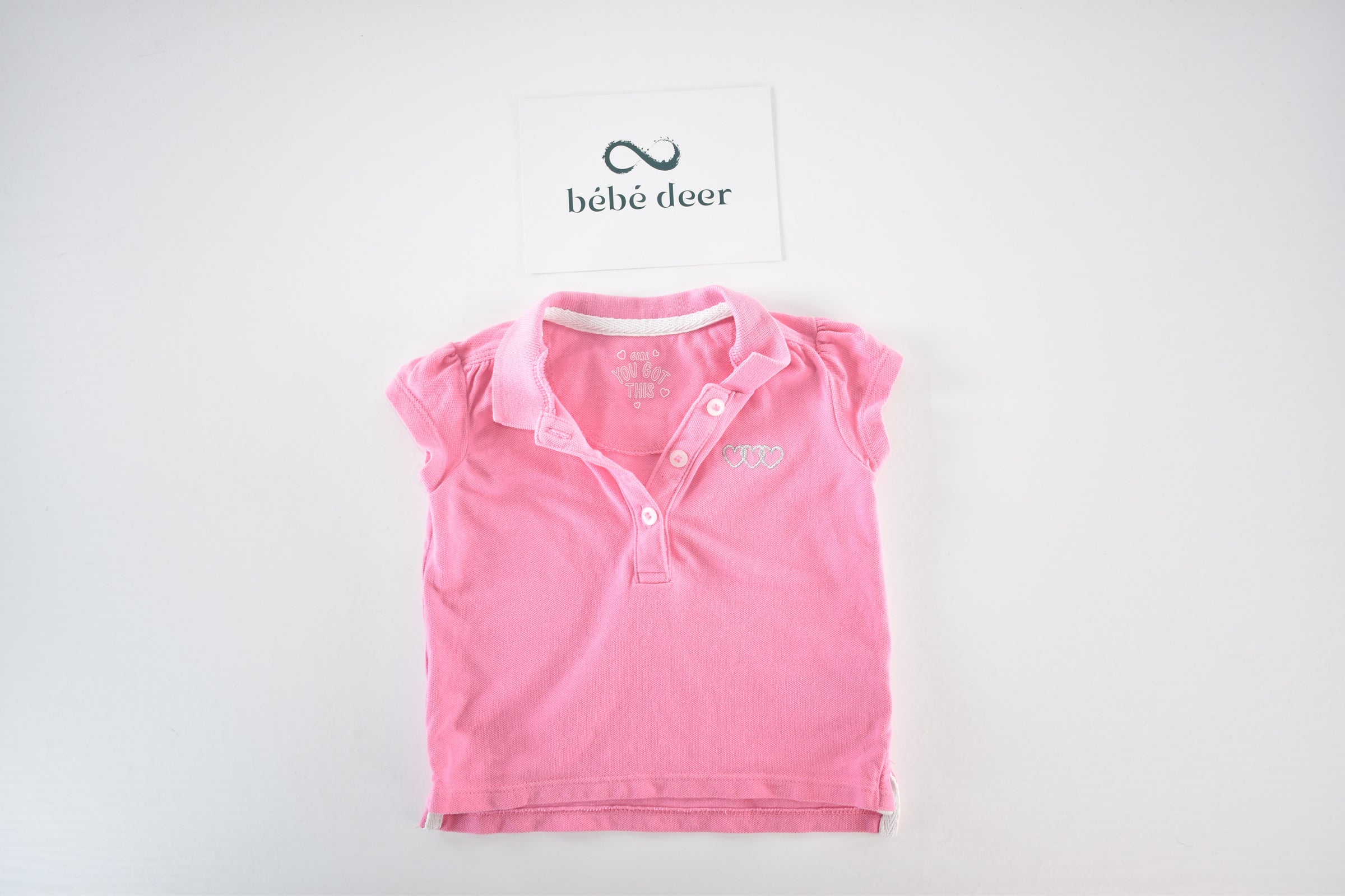 Pink polo top