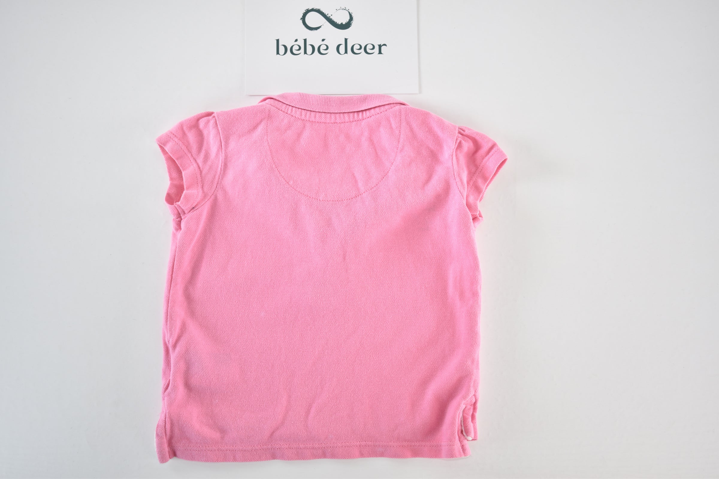 Pink polo top