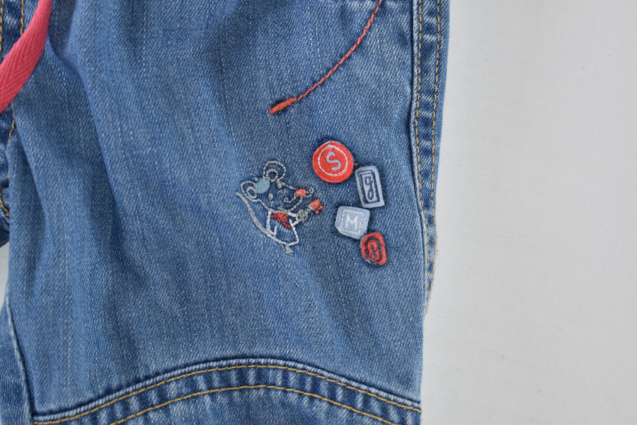 Lined denim trousers with embroidered mouse detail