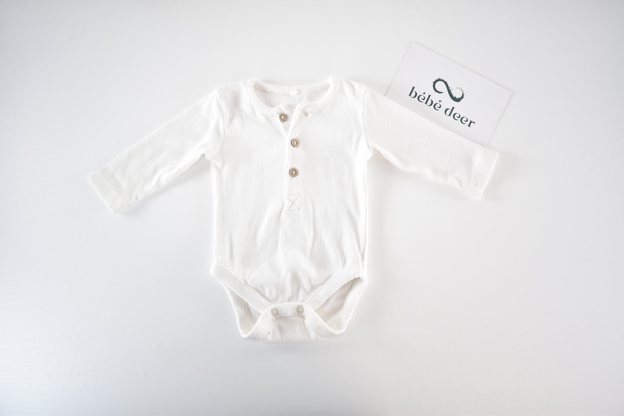 White ribbed long sleeve bodysuit