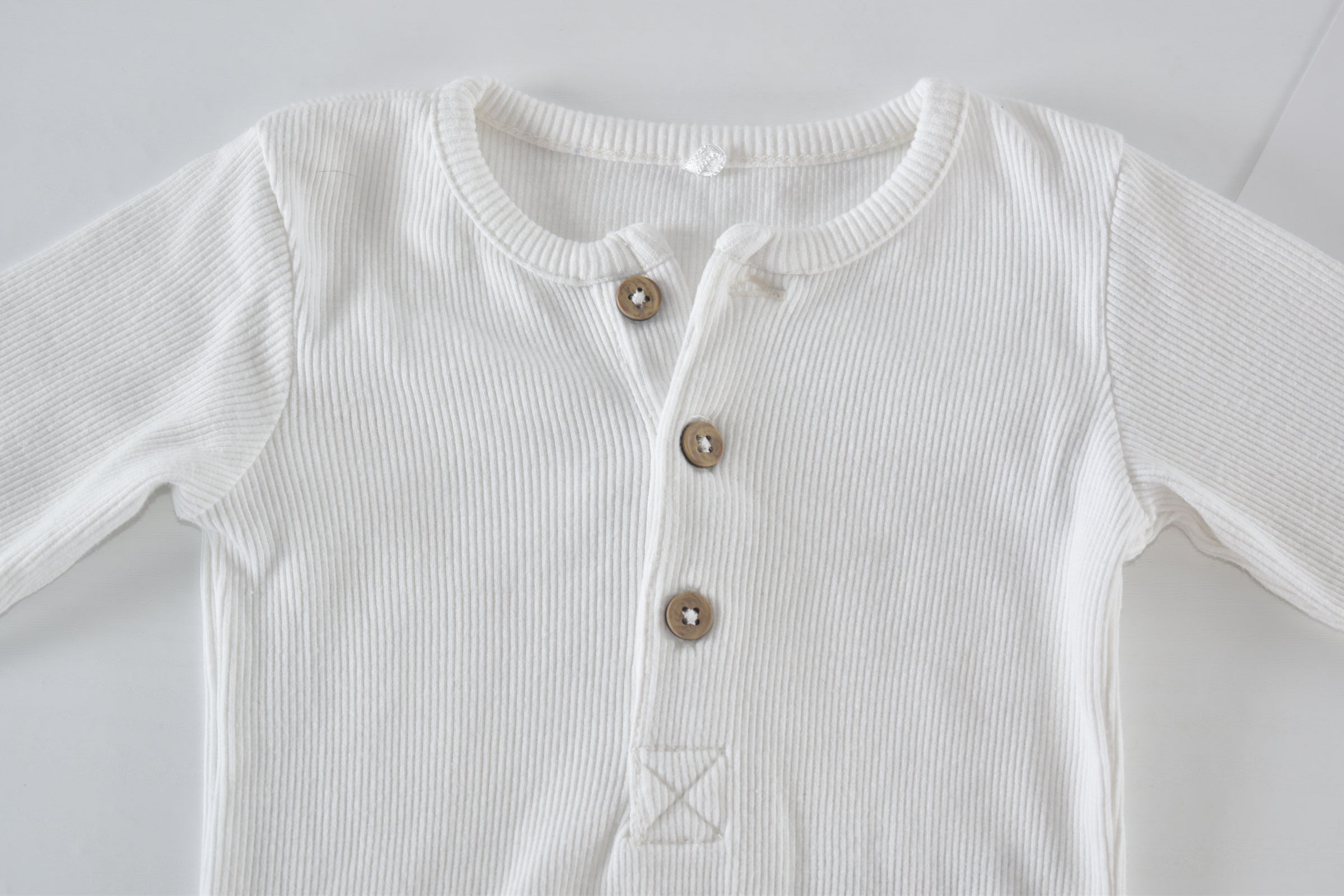 White ribbed long sleeve bodysuit
