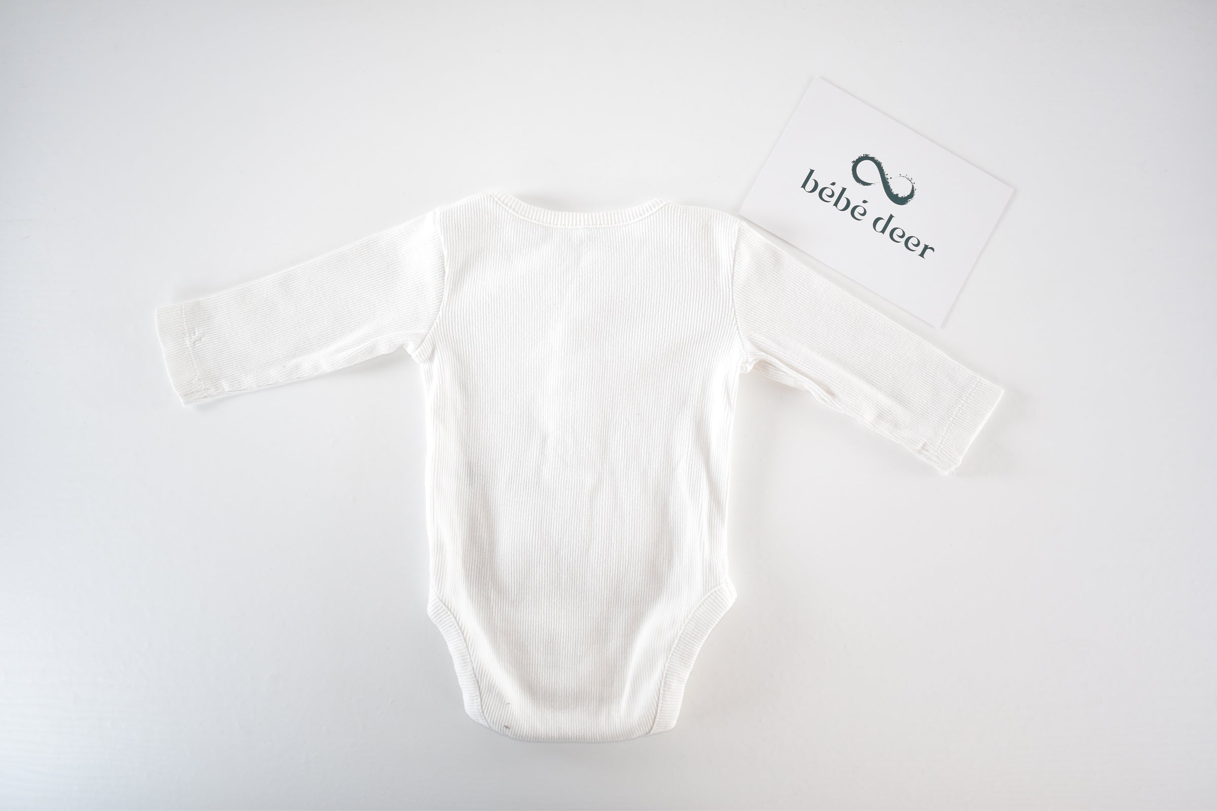White ribbed long sleeve bodysuit