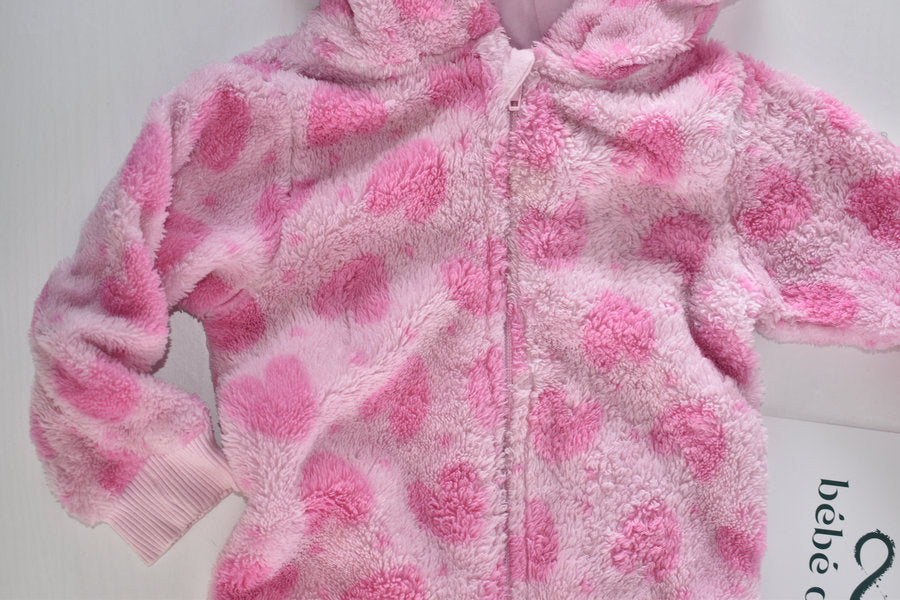 Pink fleece pramsuit with heart pattern