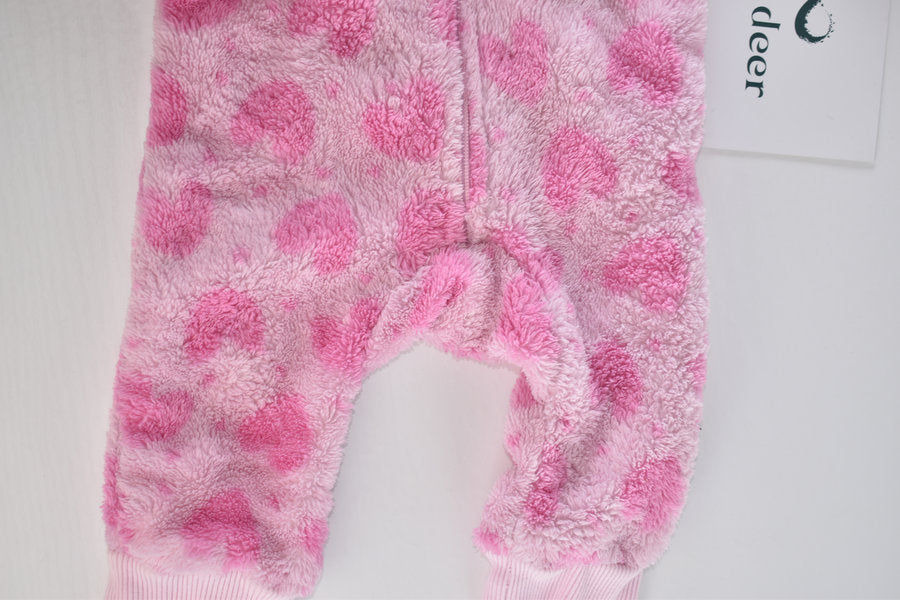 Pink fleece pramsuit with heart pattern