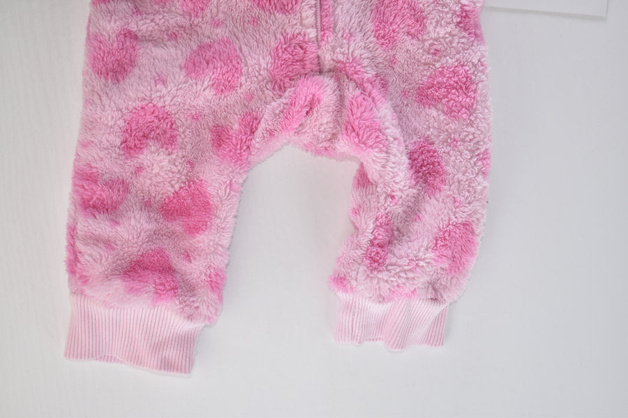 Pink fleece pramsuit with heart pattern
