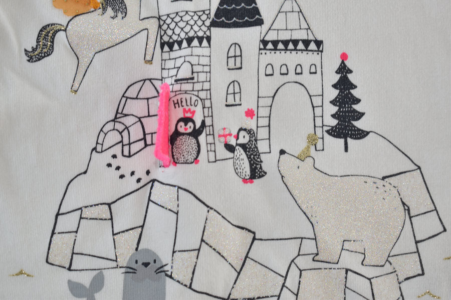 Cream long-sleeved top with interactive castle design