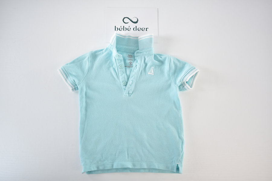 Light blue polo shirt with sailboat embroidery