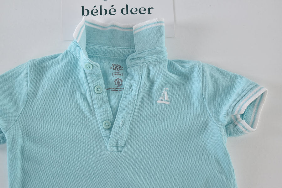 Light blue polo shirt with sailboat embroidery