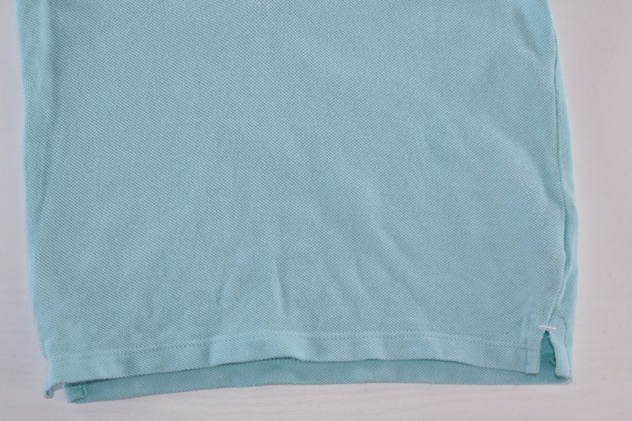 Light blue polo shirt with sailboat embroidery