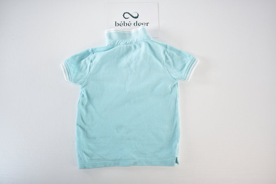 Light blue polo shirt with sailboat embroidery