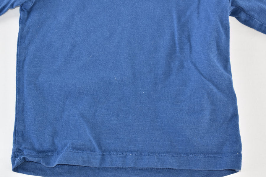 Blue long-sleeved top with embroidered car