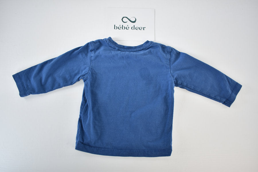 Blue long-sleeved top with embroidered car
