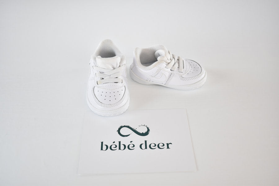 White Nike pre-walker shoes