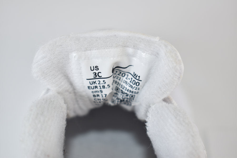 White Nike pre-walker shoes