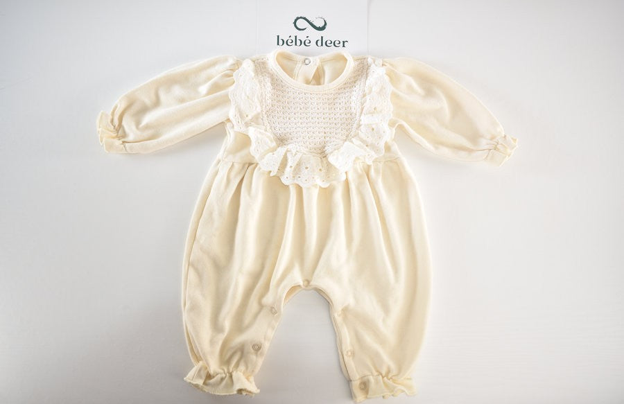 Cream sleepsuit featuring lace ruffle details