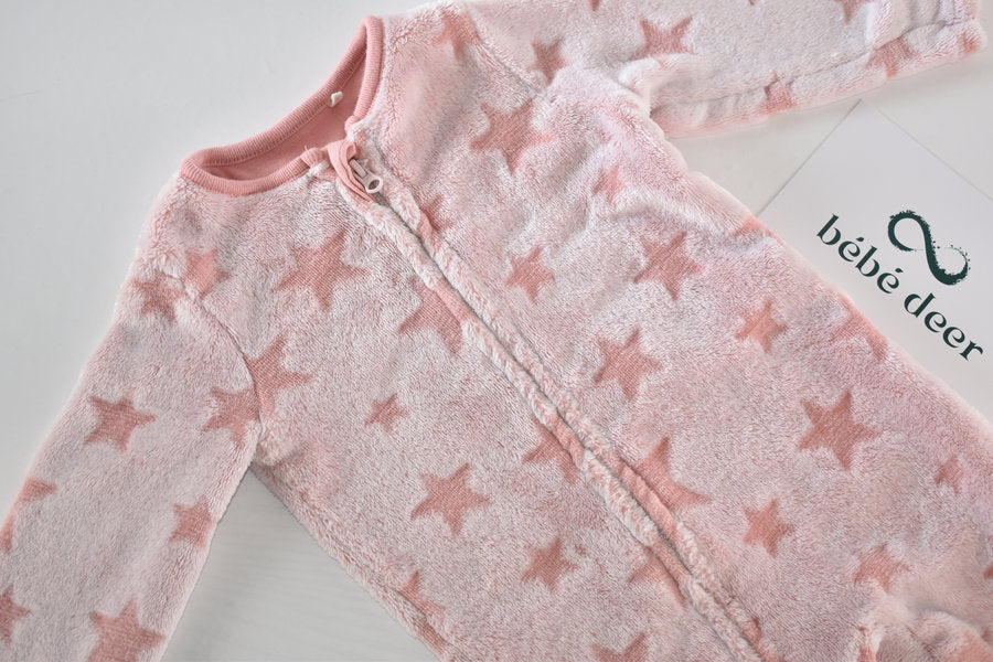 Pink fleece sleepsuit star pattern
