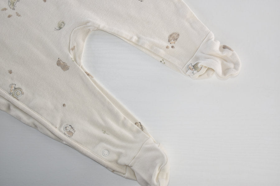 Cream sleepsuit featuring animal print