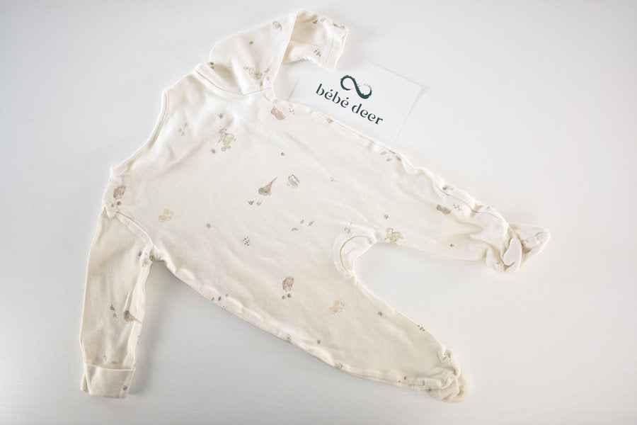 Cream sleepsuit featuring animal print