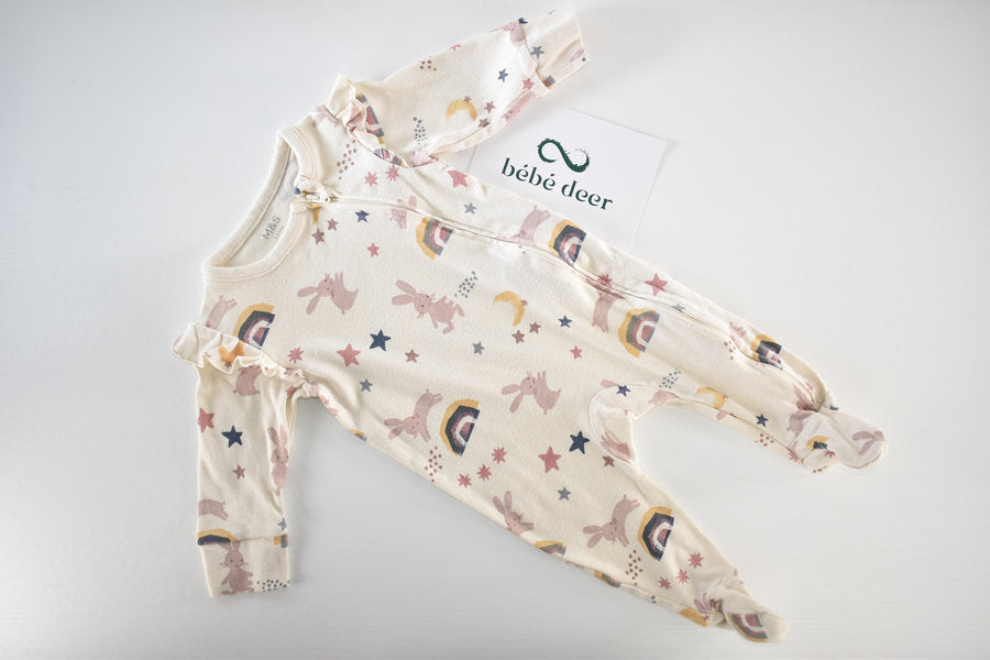 Sleepsuit with bunnies, rainbows, moons and stars