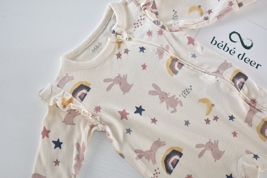 Sleepsuit with bunnies, rainbows, moons and stars