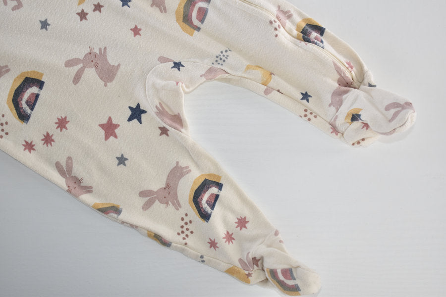 Sleepsuit with bunnies, rainbows, moons and stars