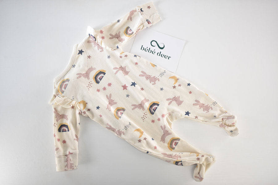 Sleepsuit with bunnies, rainbows, moons and stars