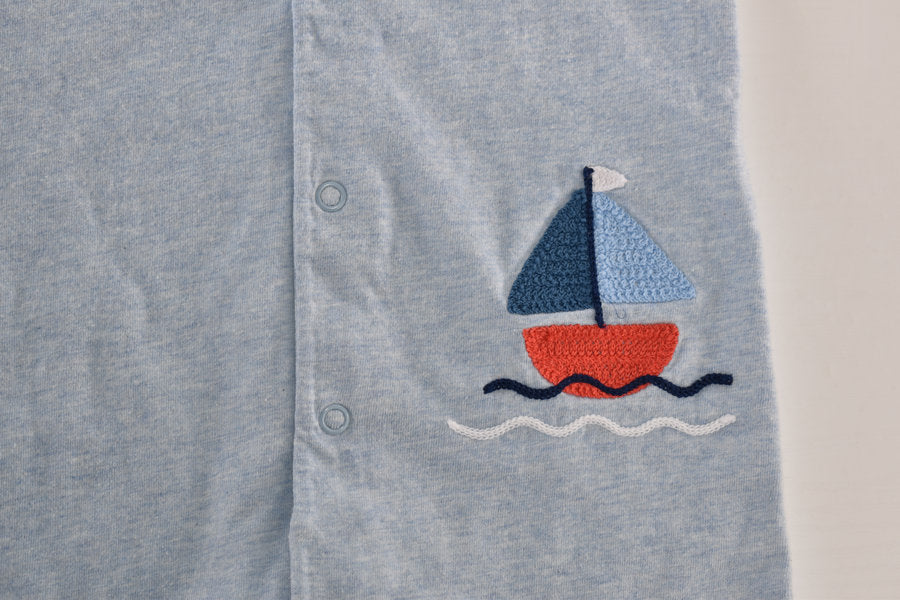 Light blue romper with a sailboat