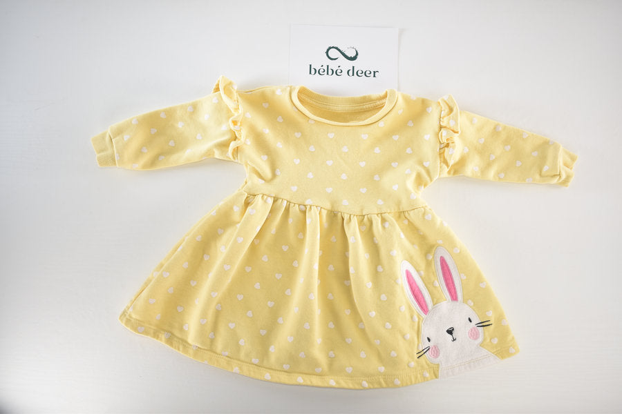 Yellow dress with white heart pattern and a bunny