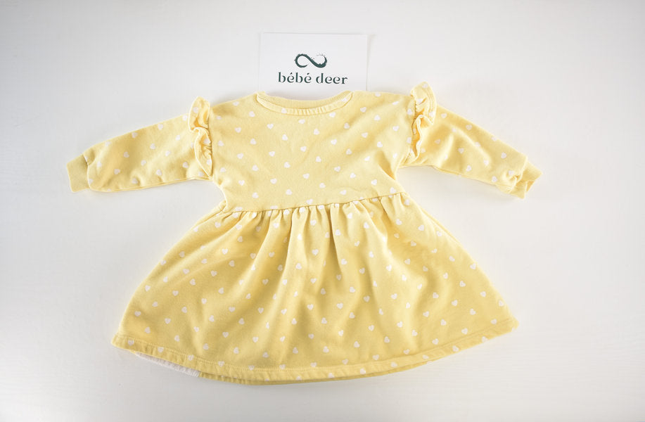 Yellow dress with white heart pattern and a bunny