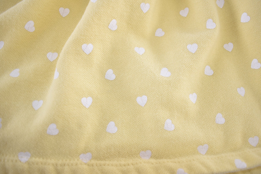 Yellow dress with white heart pattern and a bunny