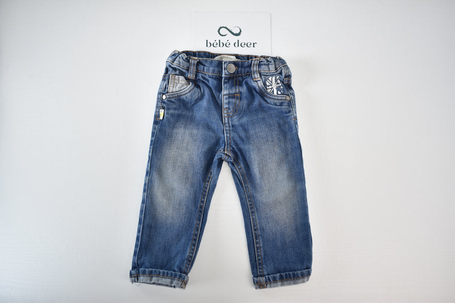 Blue denim trousers with pocket details