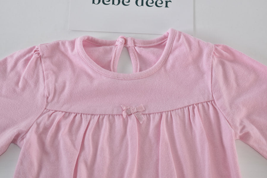 Pink long-sleeved top with bow detail