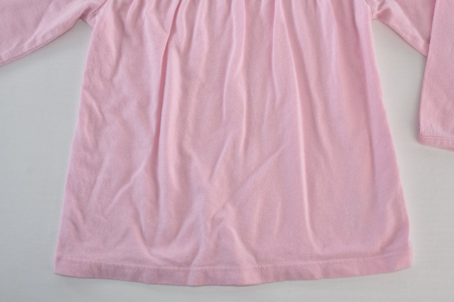 Pink long-sleeved top with bow detail