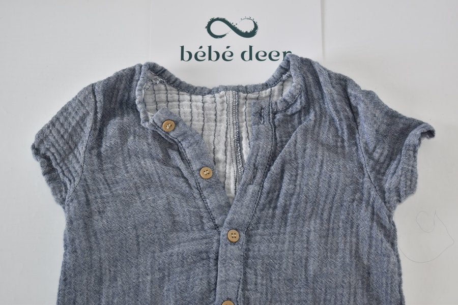 Blue muslin romper with button detail