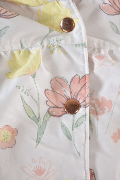 Raincoat with a pastel floral print