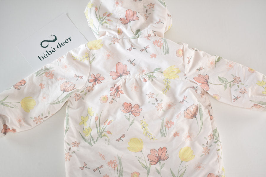 Raincoat with a pastel floral print