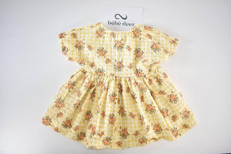 Yellow dress with a gingham and floral print