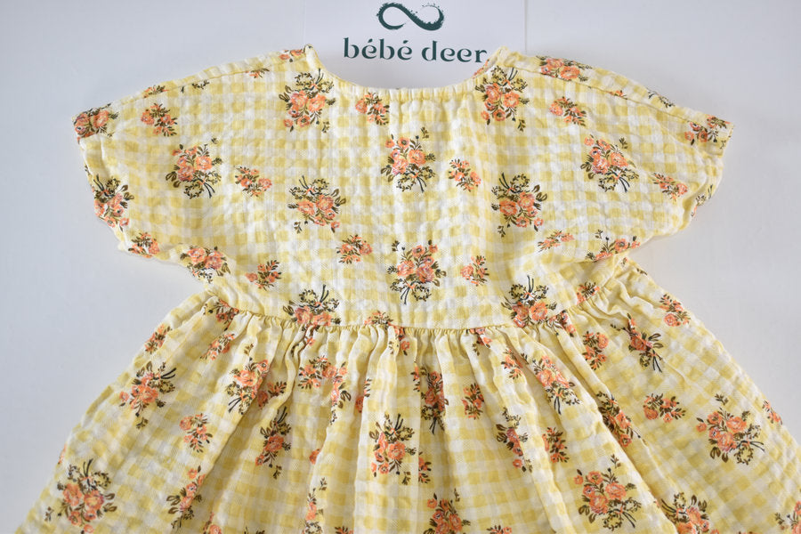 Yellow dress with a gingham and floral print