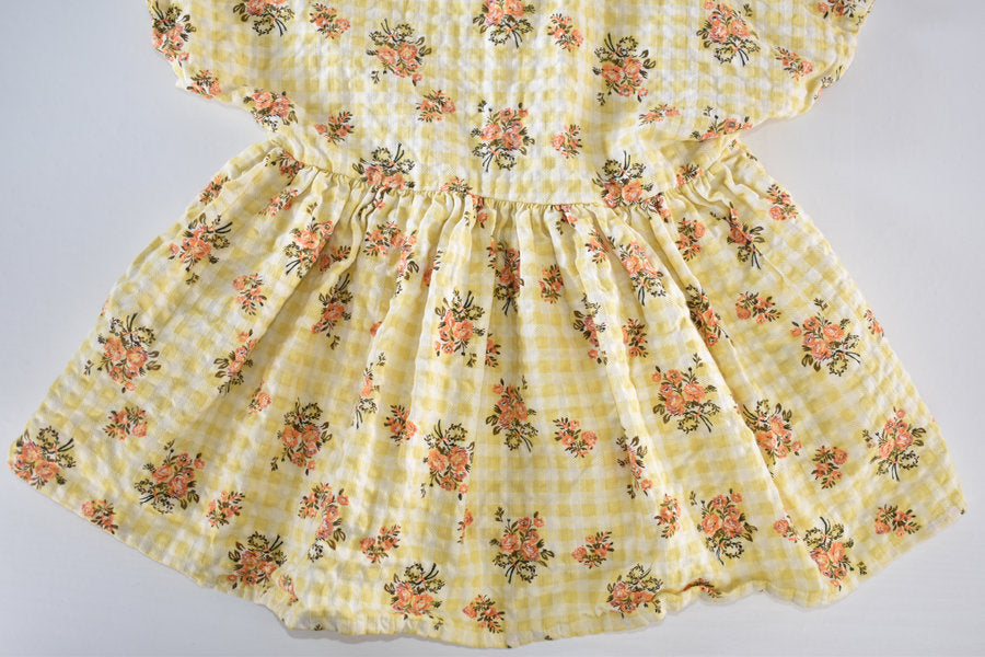 Yellow dress with a gingham and floral print