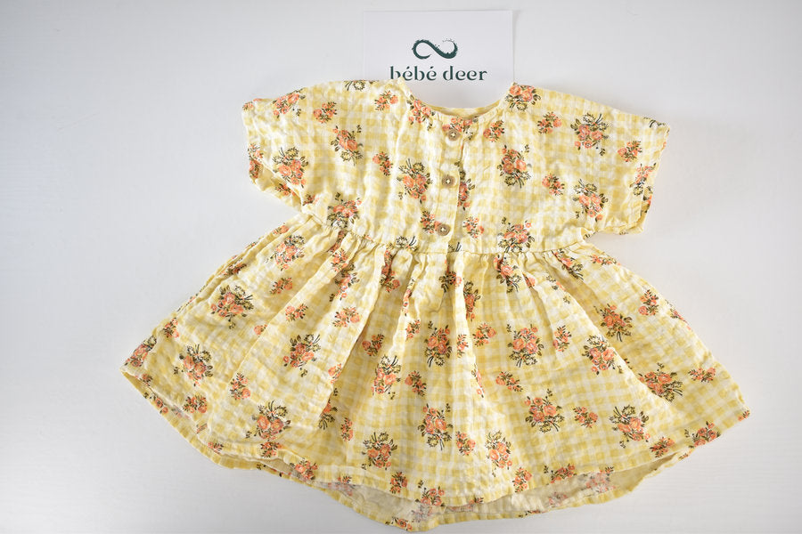 Yellow dress with a gingham and floral print
