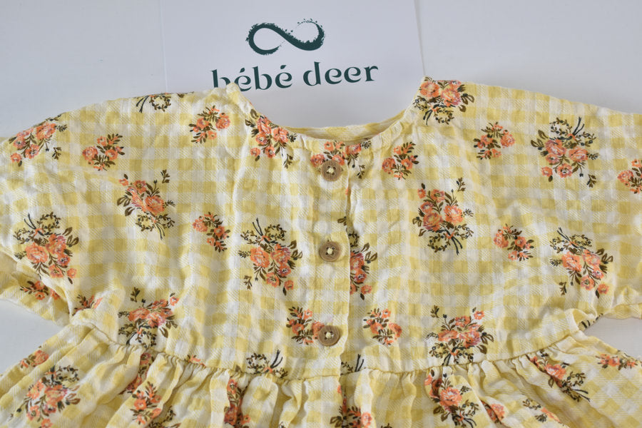 Yellow dress with a gingham and floral print
