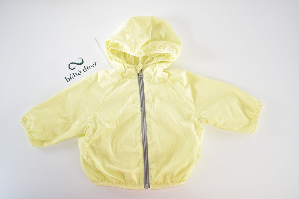 Yellow hooded lightweight jacket