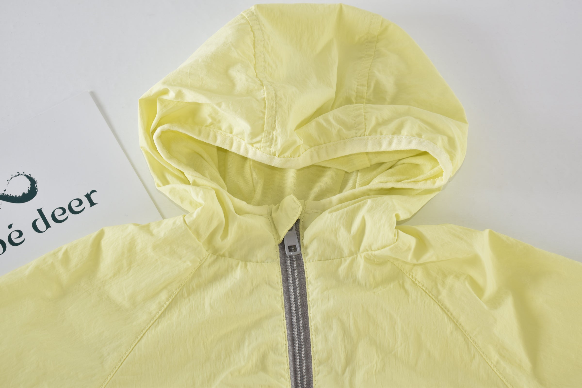 Yellow hooded lightweight jacket