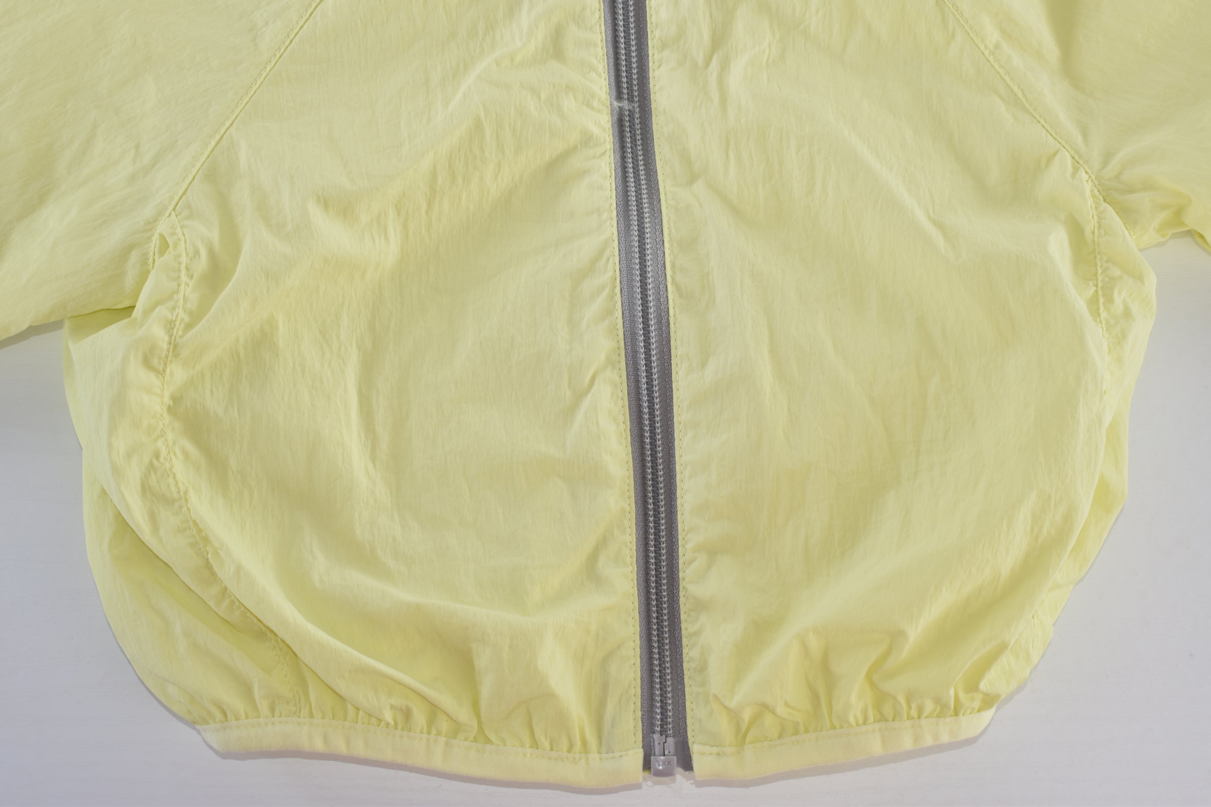 Yellow hooded lightweight jacket