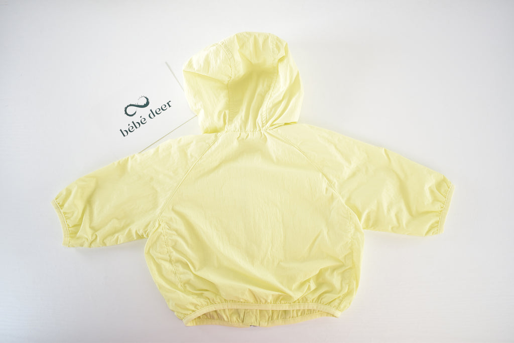 Yellow hooded lightweight jacket