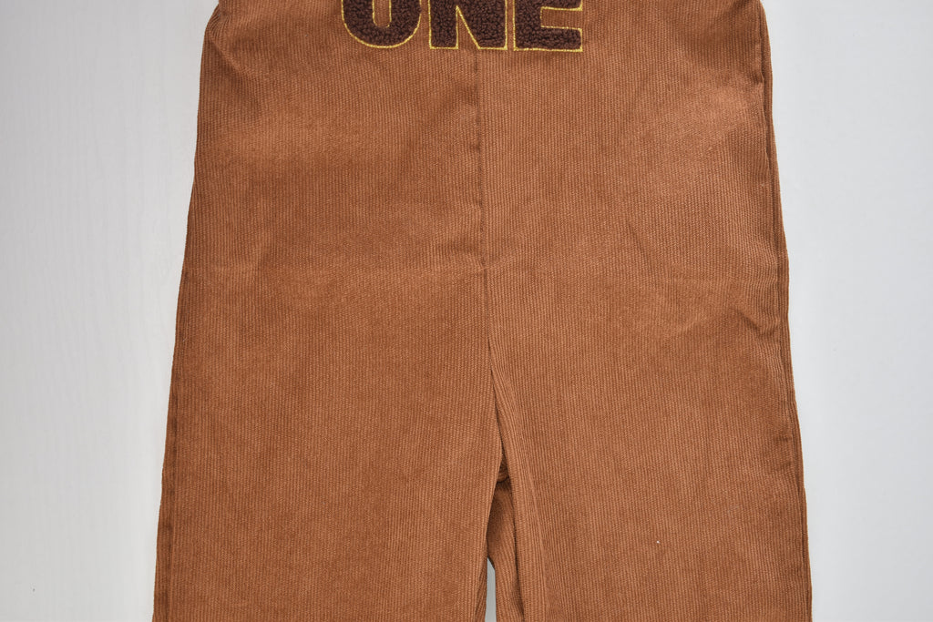 Brown cord dungarees with "ONE" appliqué