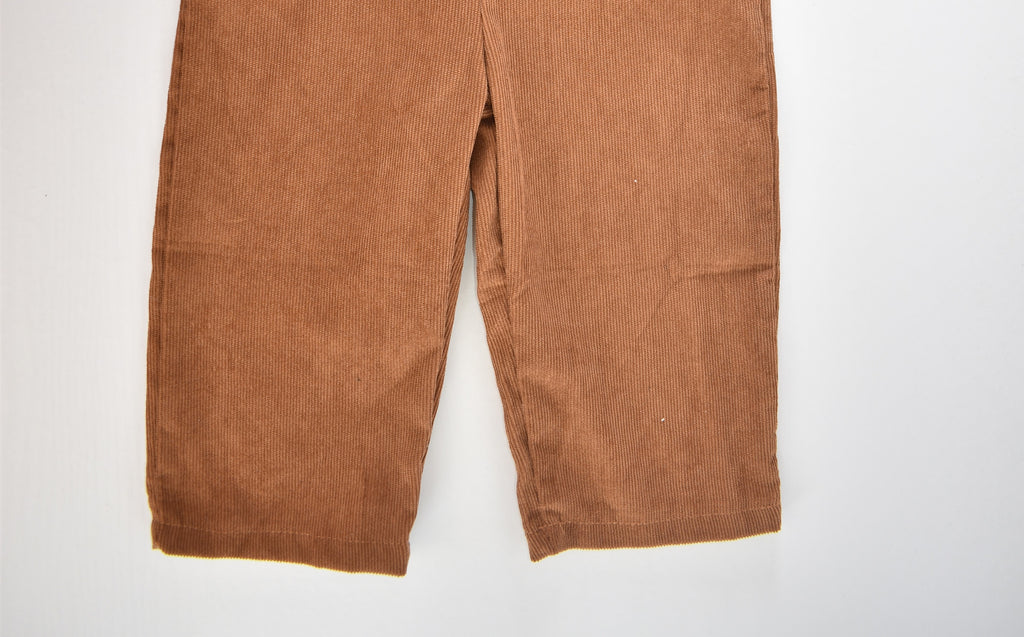 Brown cord dungarees with "ONE" appliqué